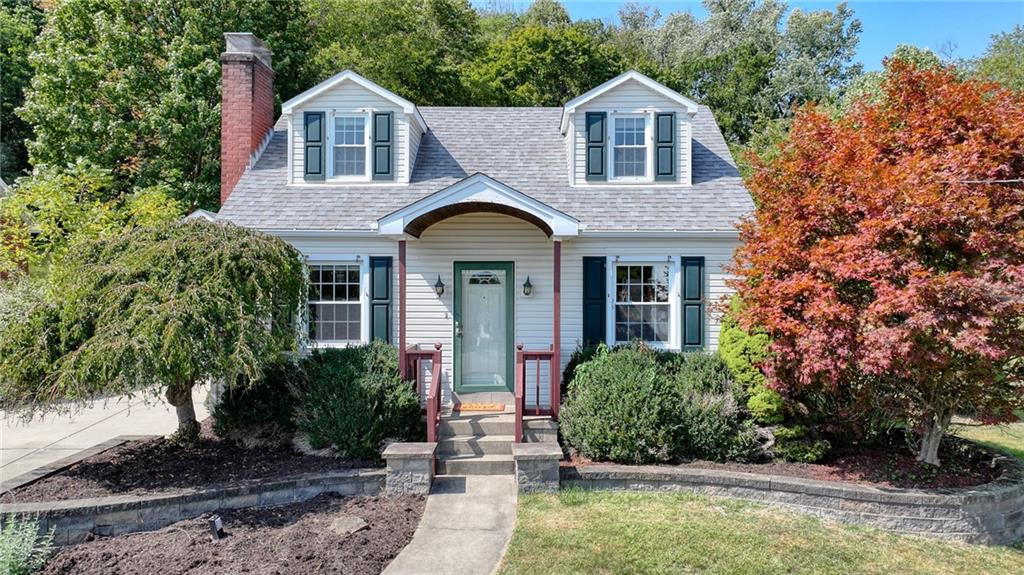 9765 Grosick Road Pittsburgh, PA 15237 - Photo 1 of 33 a front view of a house with a yard
