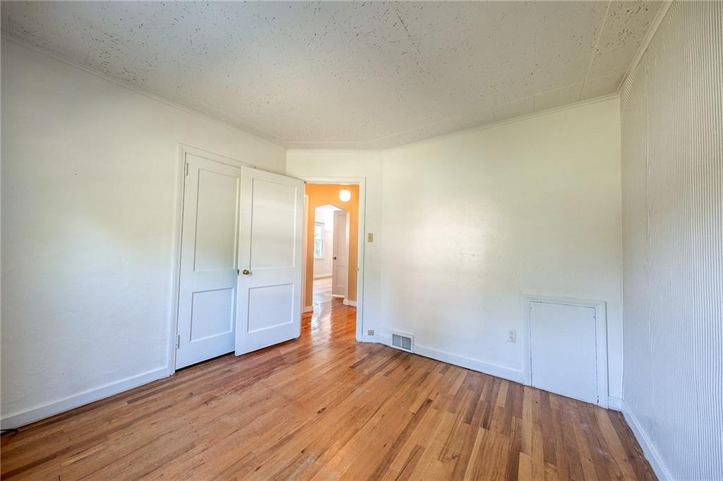 9765 Grosick Road Pittsburgh, PA 15237 - Photo 17 of 33 a view of an empty room and wooden floor