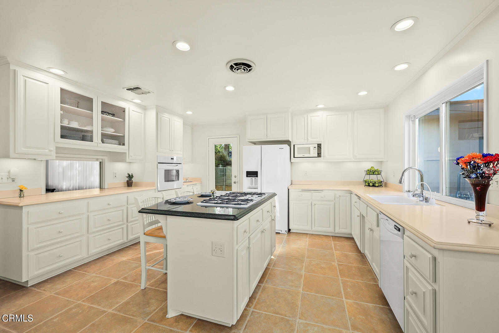 100 Sequoia Drive Pasadena, CA 91105 - Photo 11 of 51 a kitchen with white cabinets appliances and a window