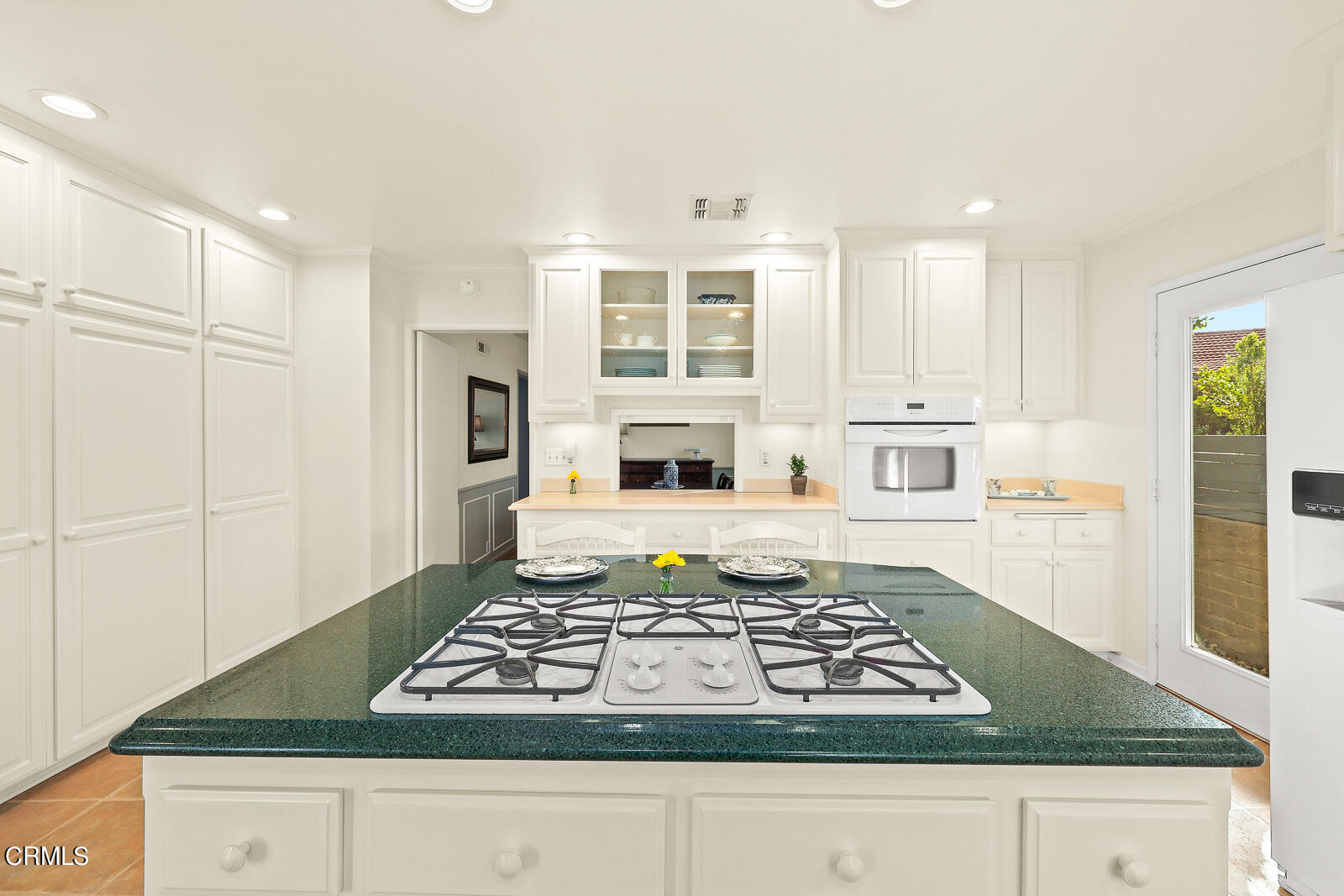 100 Sequoia Drive Pasadena, CA 91105 - Photo 12 of 51 a kitchen with kitchen island granite countertop a stove and white cabinets