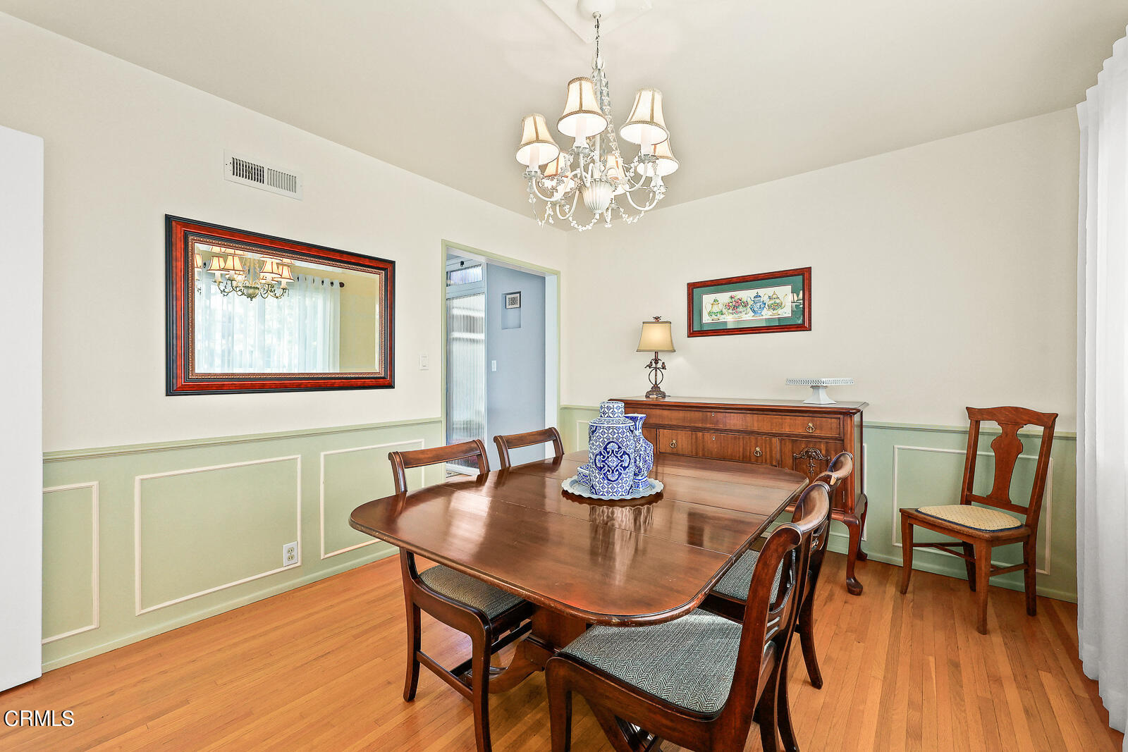 100 Sequoia Drive Pasadena, CA 91105 - Photo 16 of 51 a view of a dining room with furniture wooden floor and a chandelier