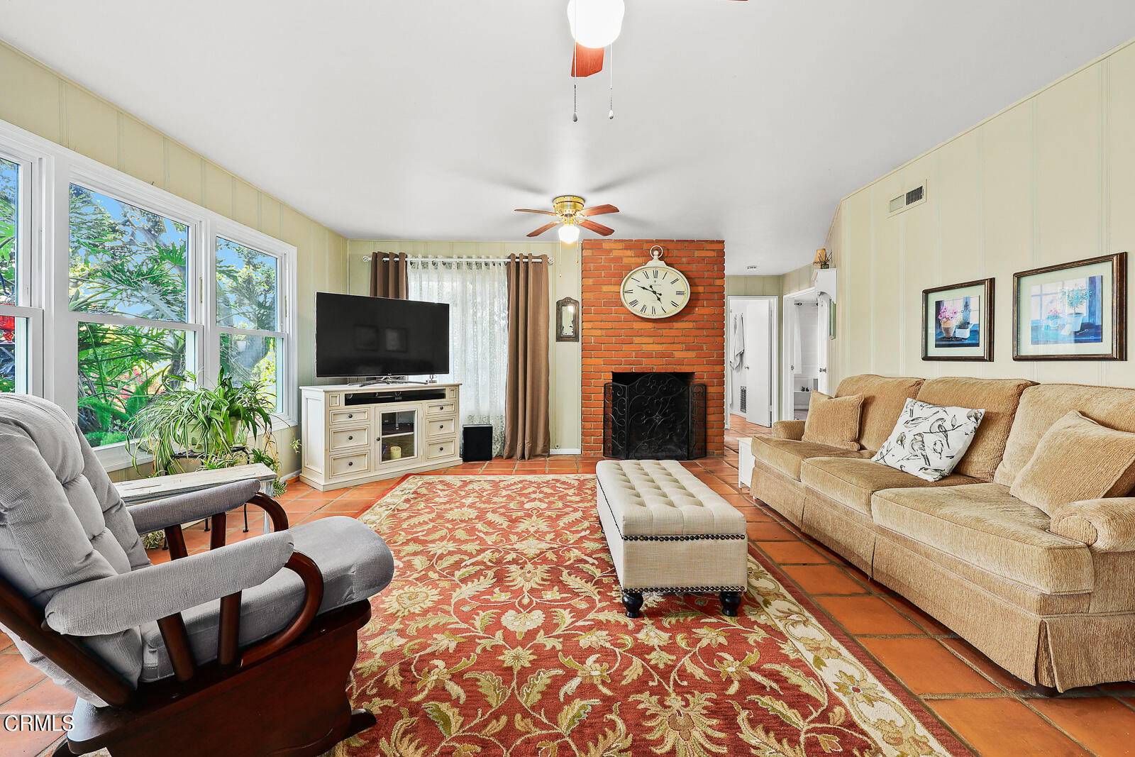 100 Sequoia Drive Pasadena, CA 91105 - Photo 27 of 51 a living room with furniture a fireplace and a flat screen tv