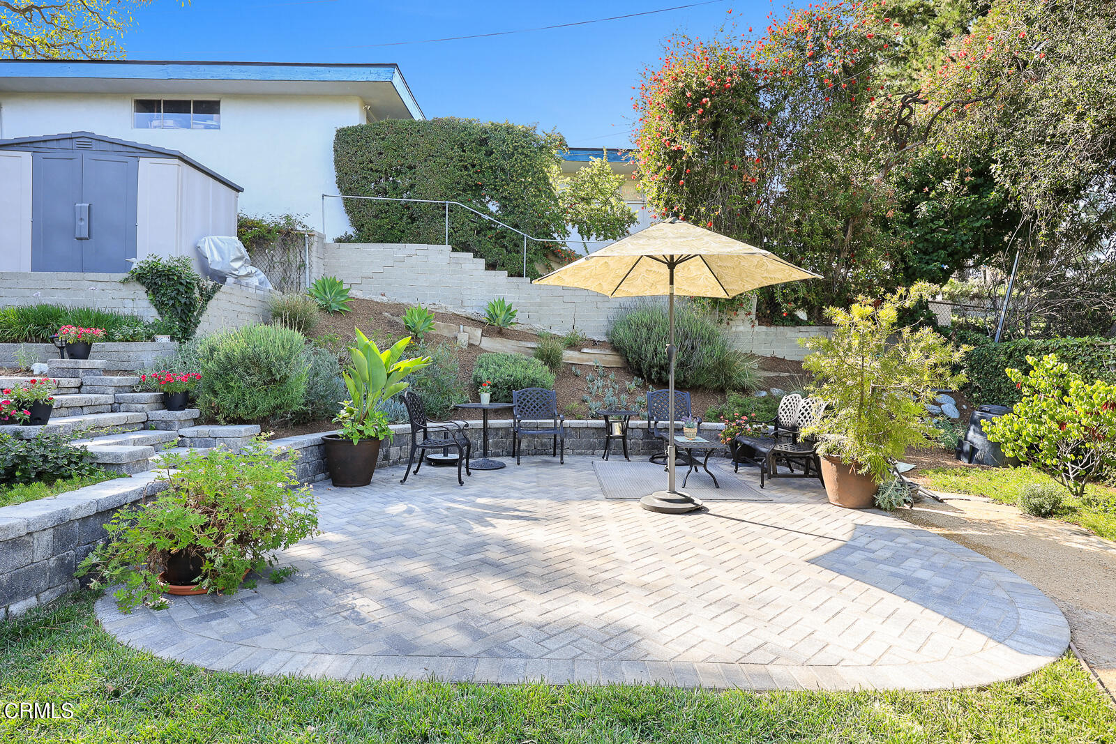 100 Sequoia Drive Pasadena, CA 91105 - Photo 39 of 51 a view of a patio with a table and chairs under an umbrella