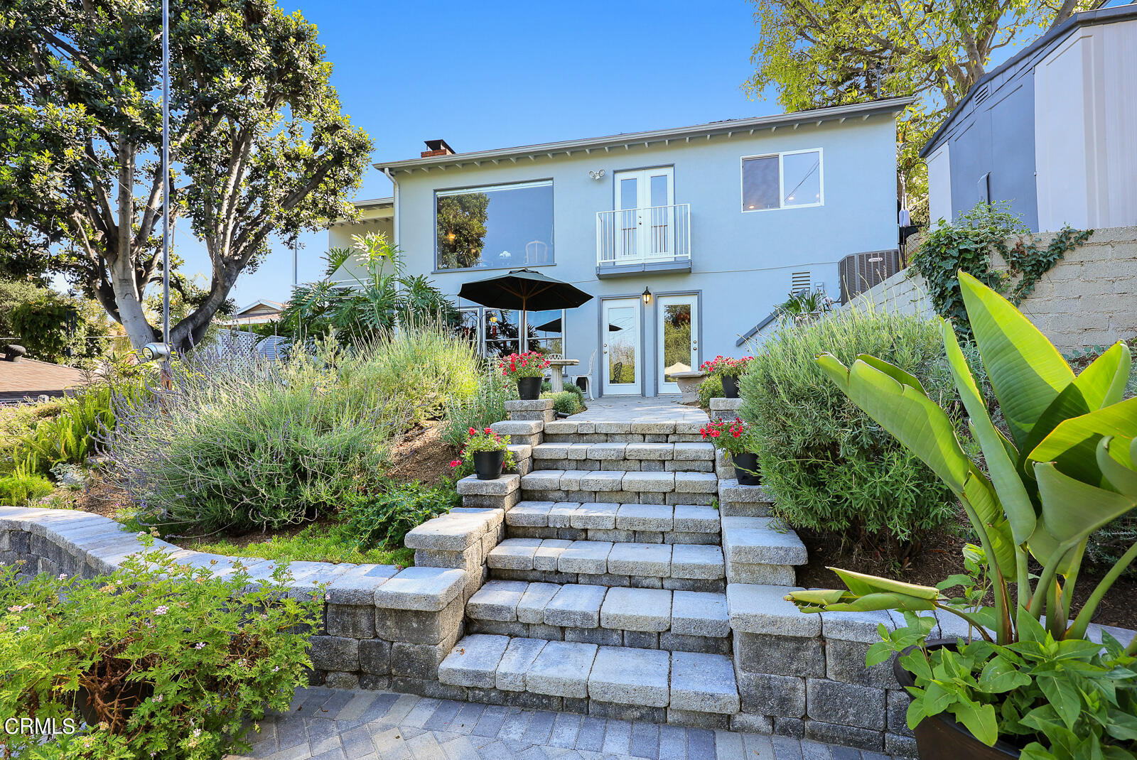 100 Sequoia Drive Pasadena, CA 91105 - Photo 41 of 51 a view of a house with potted plants and a fountain