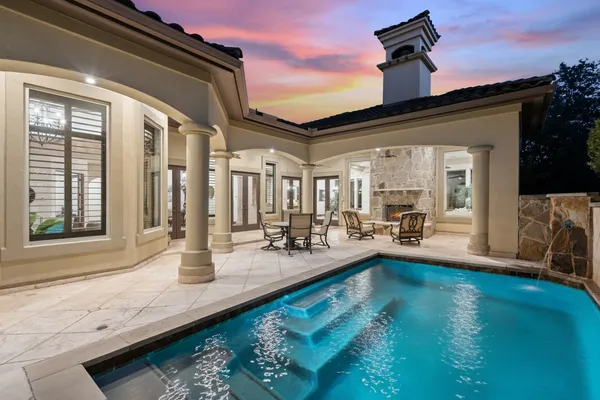 a view of swimming pool with outdoor seating