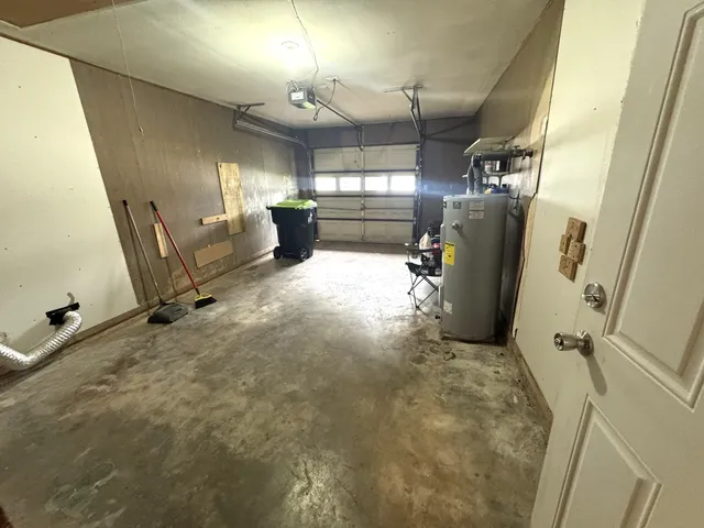 a view of a backyard with table and chairs under an umbrella with a big yard