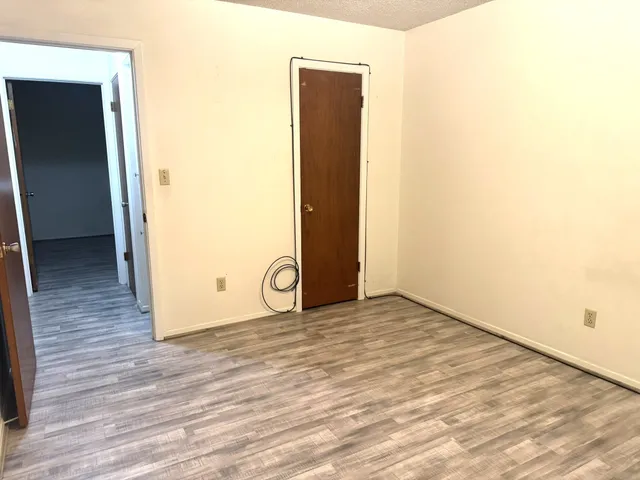 a white toilet sitting next to a bathroom sink and a mirror