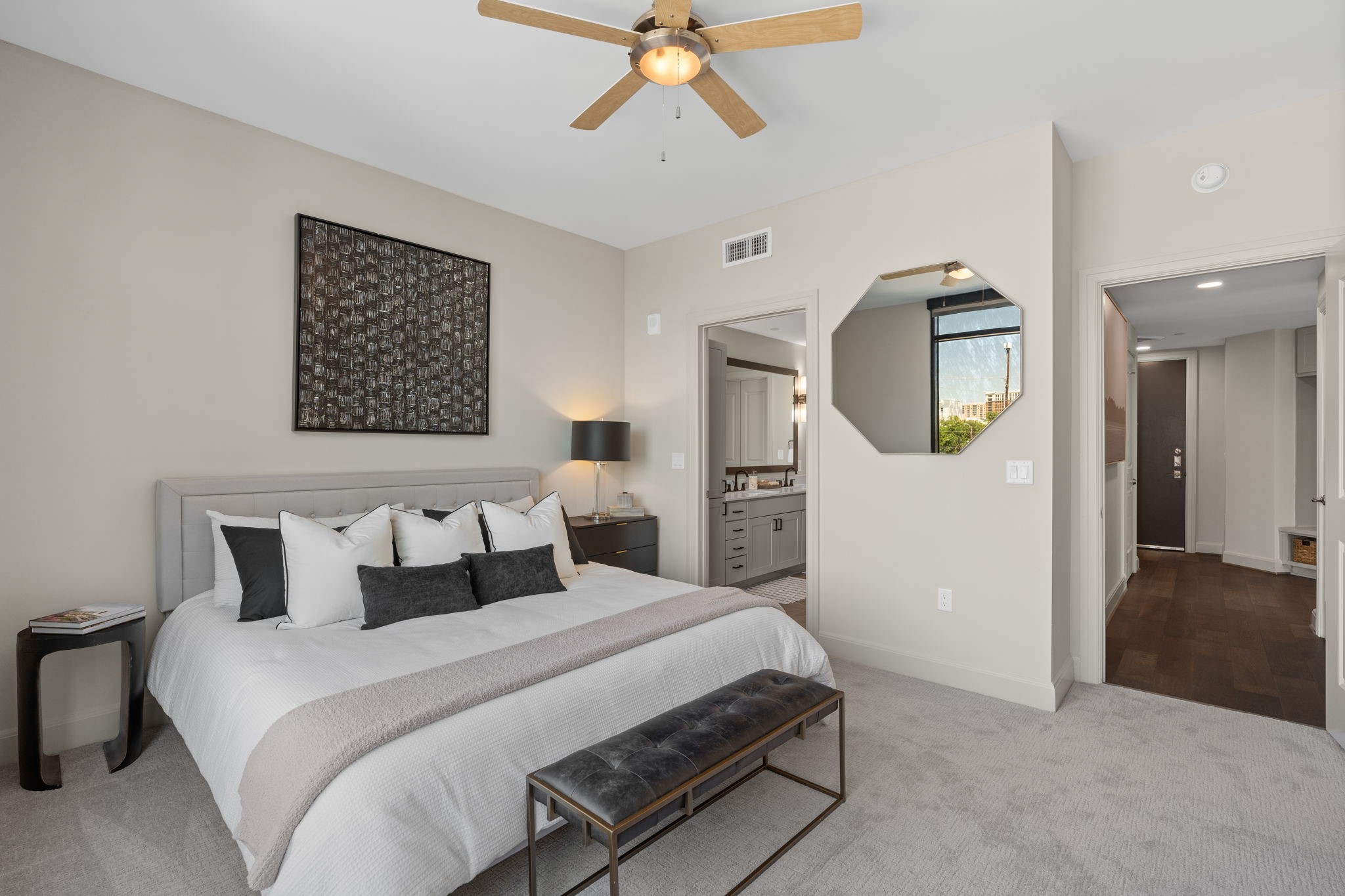 2511 Willowick Road, Unit 317 Houston, TX 77027 - Photo 14 of 44 a bedroom with a bed and a chandelier