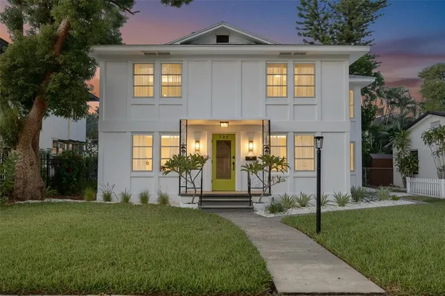 a front view of a house with a yard