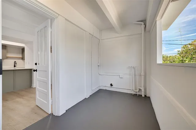 a kitchen with stainless steel appliances a stove microwave and refrigerator