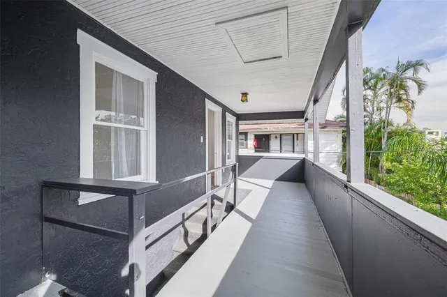 an aerial view of a house with a yard basket ball court and outdoor seating