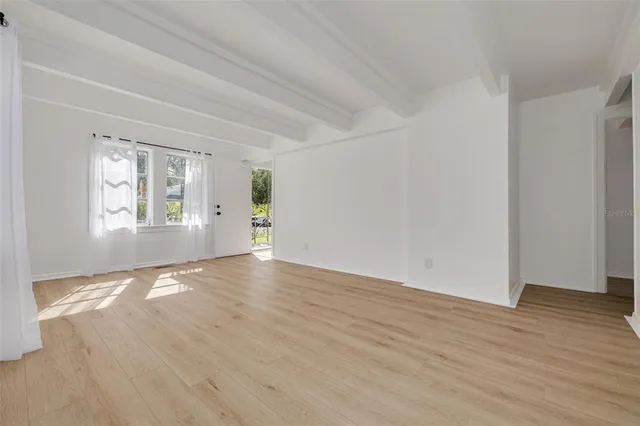 a kitchen with stainless steel appliances a stove microwave and sink