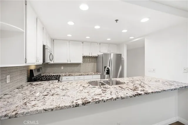 a kitchen with a sink and a window