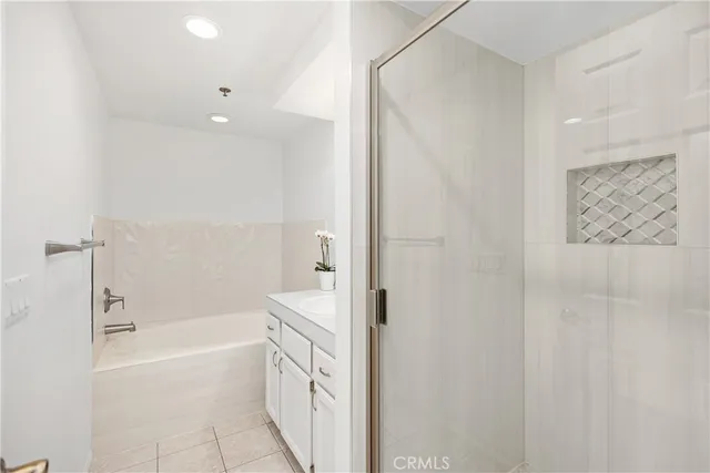 a bathroom with a shower and a sink