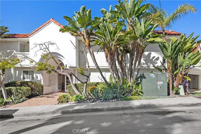 a kitchen with granite countertop a refrigerator sink and microwave