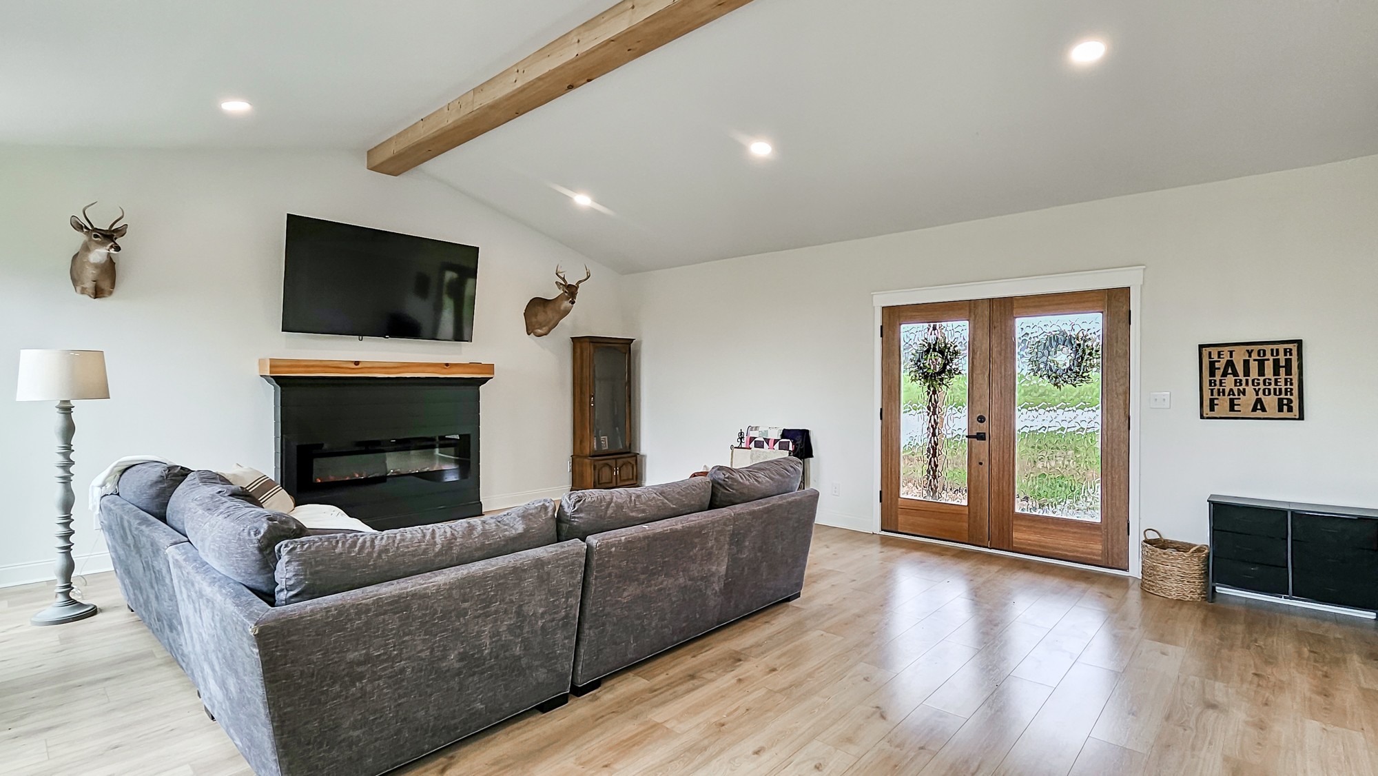 25872 Union Hill Road Ardmore, TN 38449 - Photo 8 of 28 a living room with furniture a fireplace and a flat screen tv