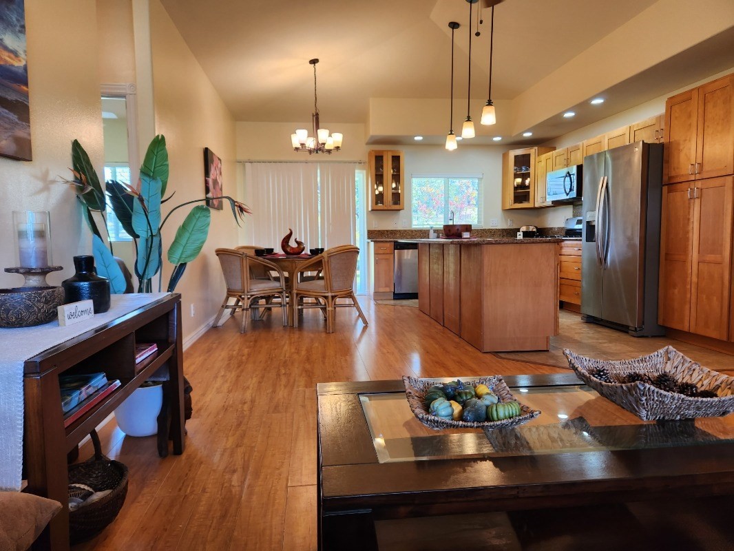 1507 Haleloke Street Hilo, HI 96720 - Photo 16 of 21 a view of a dining room with furniture a potted plant and wooden floor