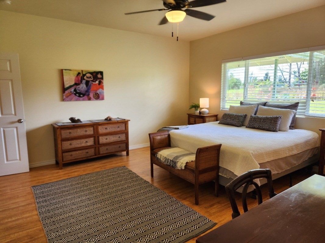 1507 Haleloke Street Hilo, HI 96720 - Photo 6 of 21 a bedroom with a bed and wooden floor