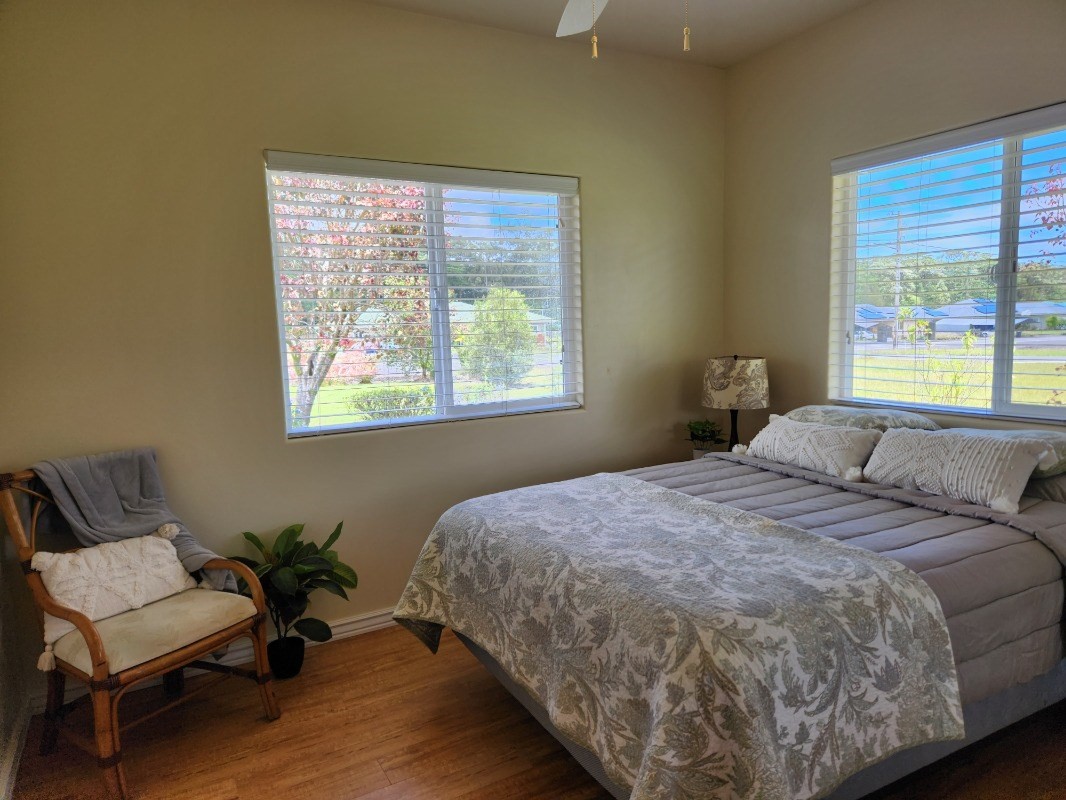 1507 Haleloke Street Hilo, HI 96720 - Photo 8 of 21 a bedroom with a bed and a chair