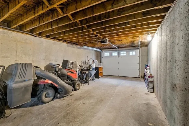 a view of a garage with parked cars