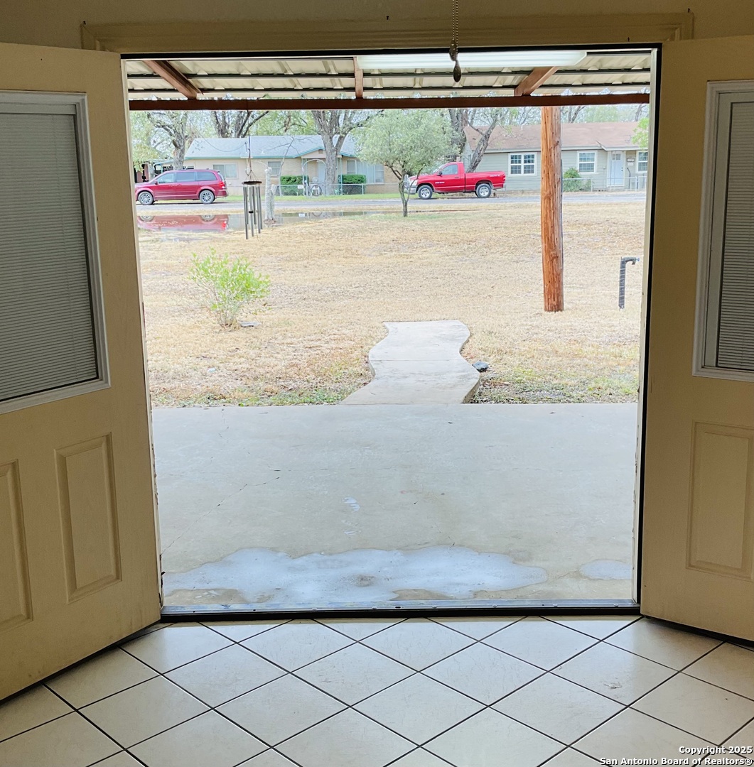 517 West Barnard Sabinal, TX 78881 - Photo 14 of 17 a view of front door with washer and dryer