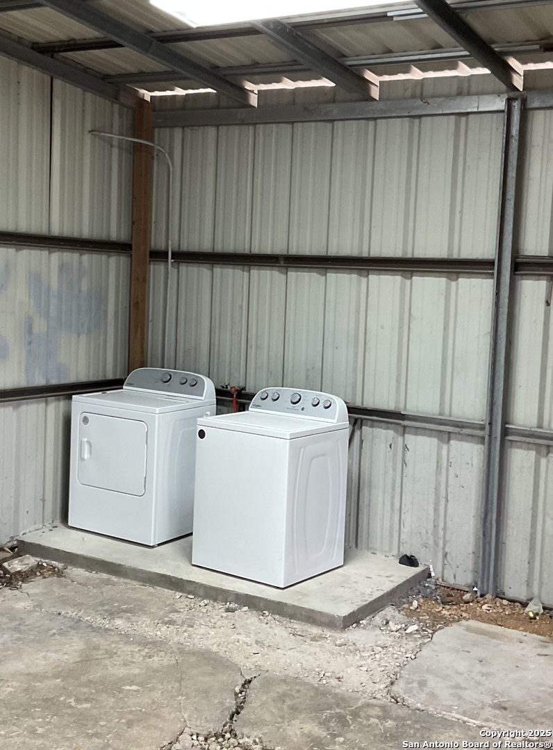 517 West Barnard Sabinal, TX 78881 - Photo 17 of 17 a utility room with dryer and washer
