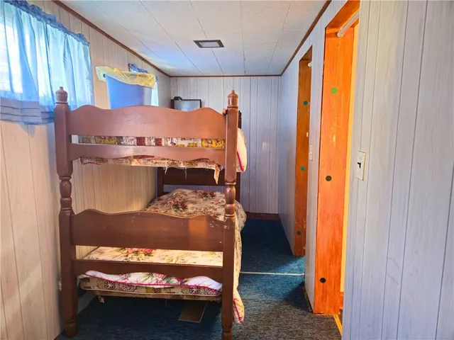 a room with a bed and a window