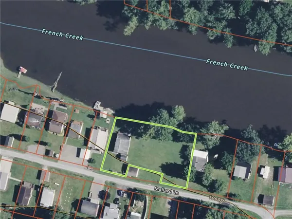 an aerial view of multiple houses with yard