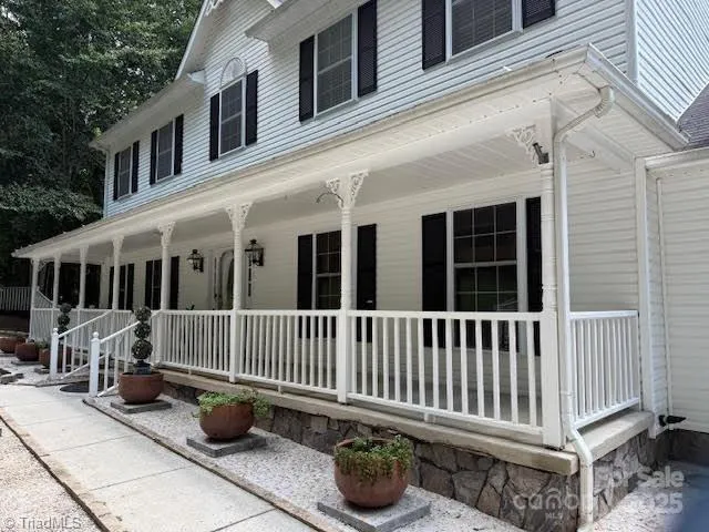 a view of a chair and table in the balcony