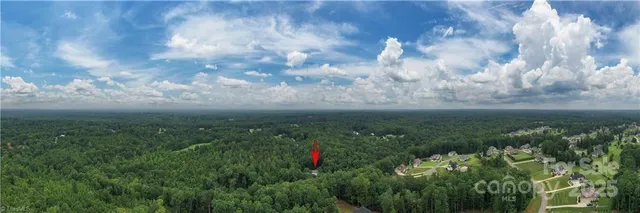 a view of a house in a forest