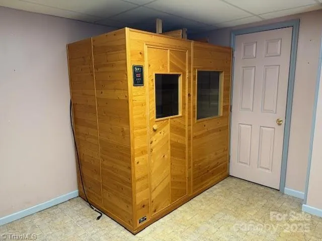 a view of a roof deck with wooden fence and floor