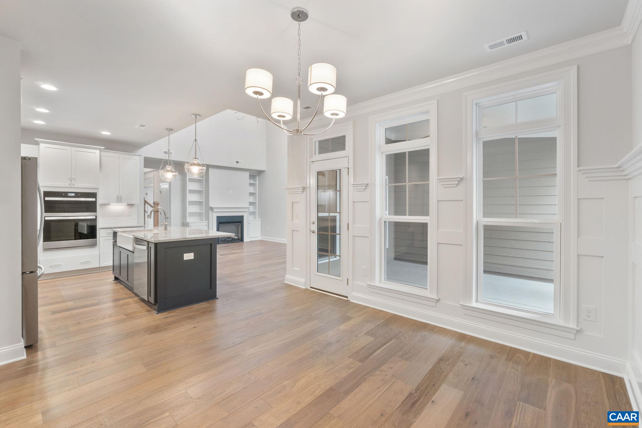 939 Addle Hill Road Crozet, VA 22932 - Photo 25 of 40 a large kitchen with granite countertop a large counter top appliances and cabinets