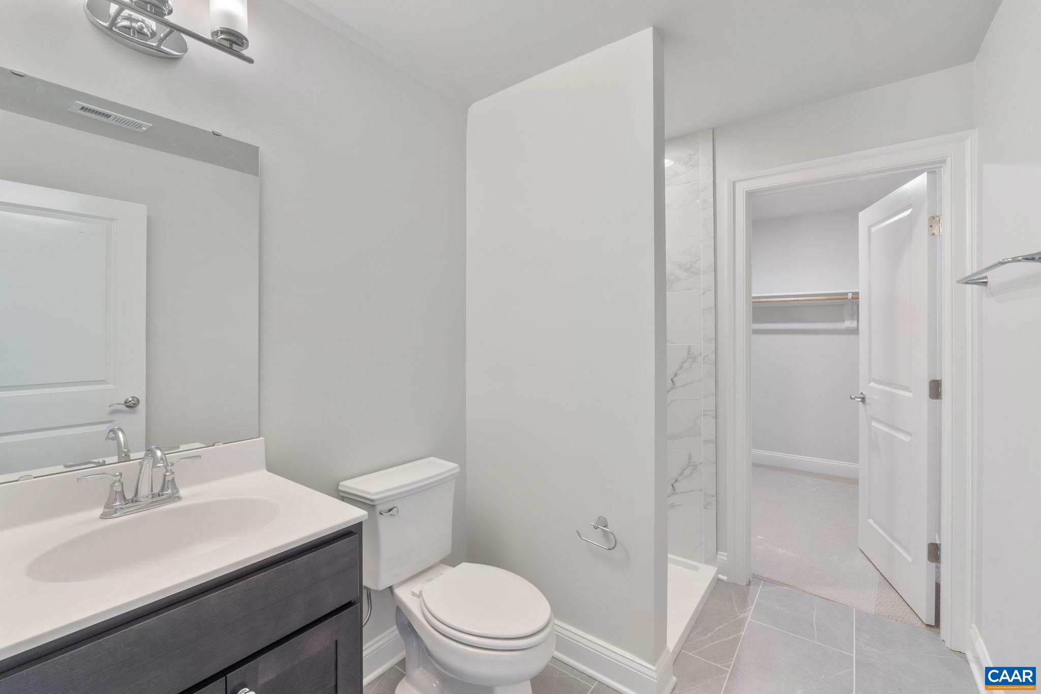 939 Addle Hill Road Crozet, VA 22932 - Photo 30 of 40 a bathroom with a sink toilet and vanity