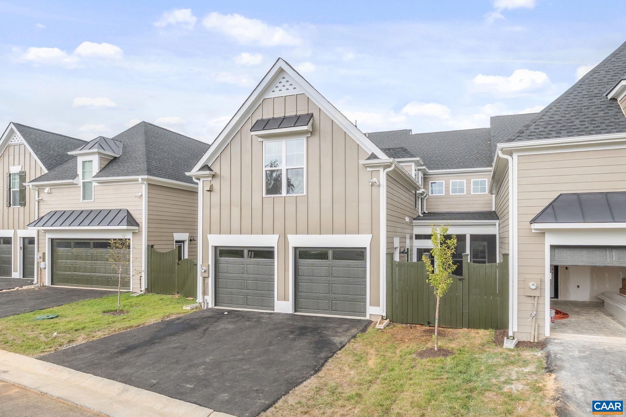 939 Addle Hill Road Crozet, VA 22932 - Photo 5 of 40 a front view of a house with a yard and garage