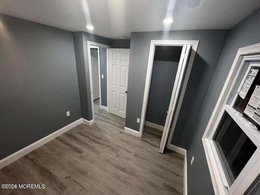 6611 Magnolia Drive Millville, NJ 08332 - Photo 13 of 14 an empty room with wooden floor and a sink