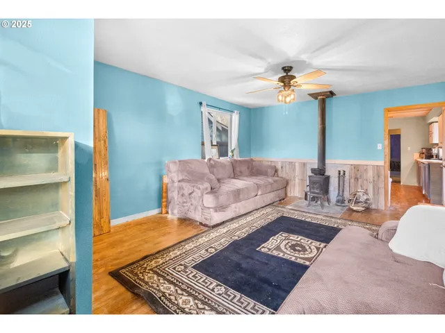 a living room with furniture and a rug