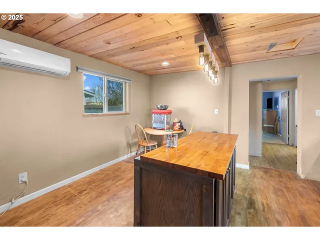 a room with a table and chairs