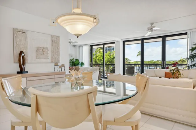 a view of a dining room with furniture wooden floor and a chandelier