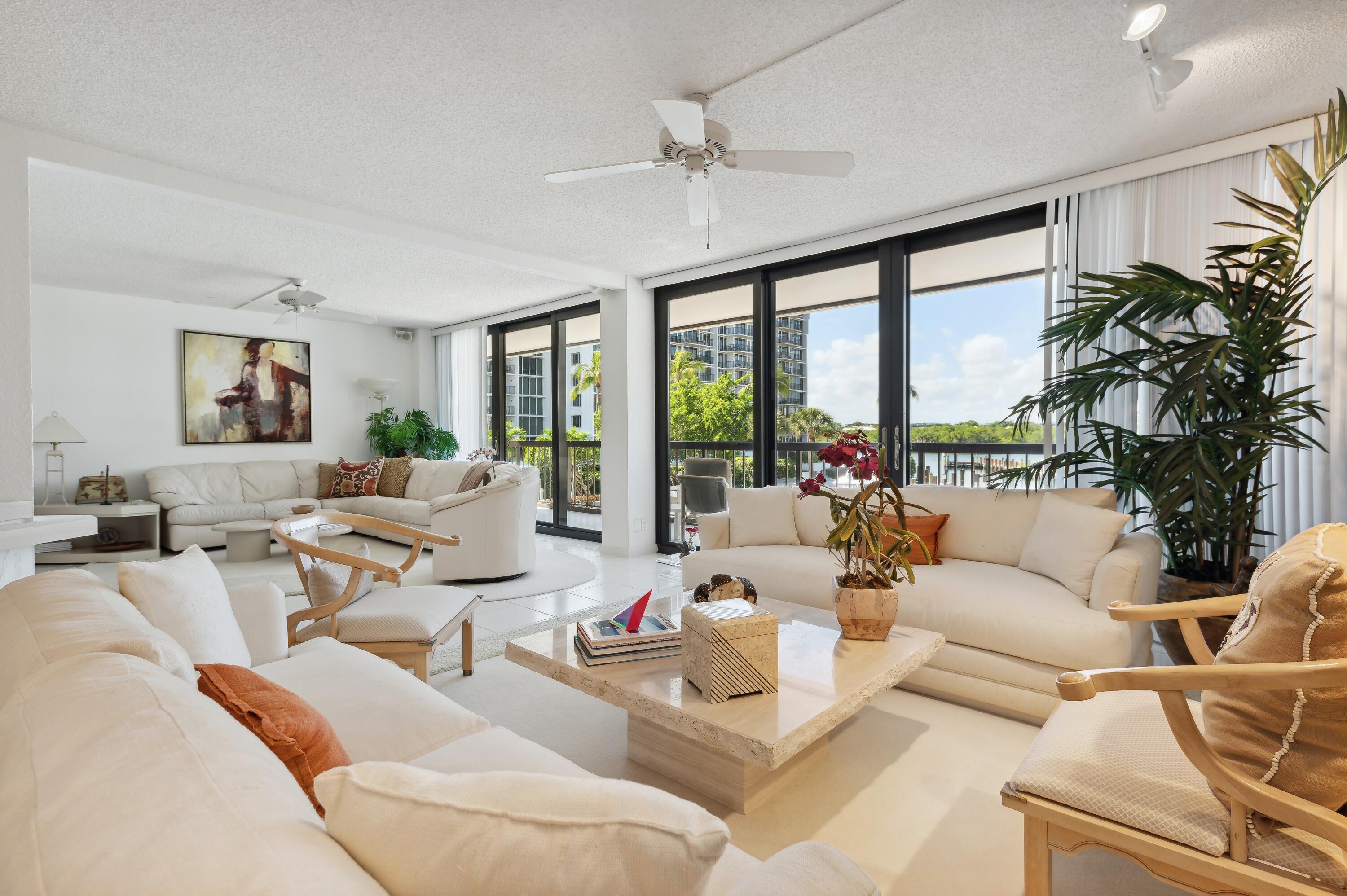 4748 South Ocean Boulevard, Unit 206 Highland Beach, FL 33487 - Photo 6 of 31 a living room with furniture and large windows