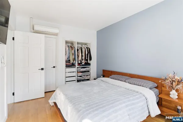 a bedroom with a bed and a closet