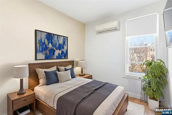 a bedroom with bed and a window