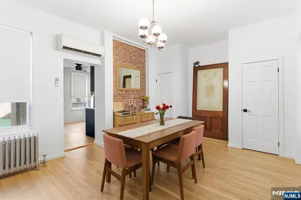 a view of a dining room with furniture and window