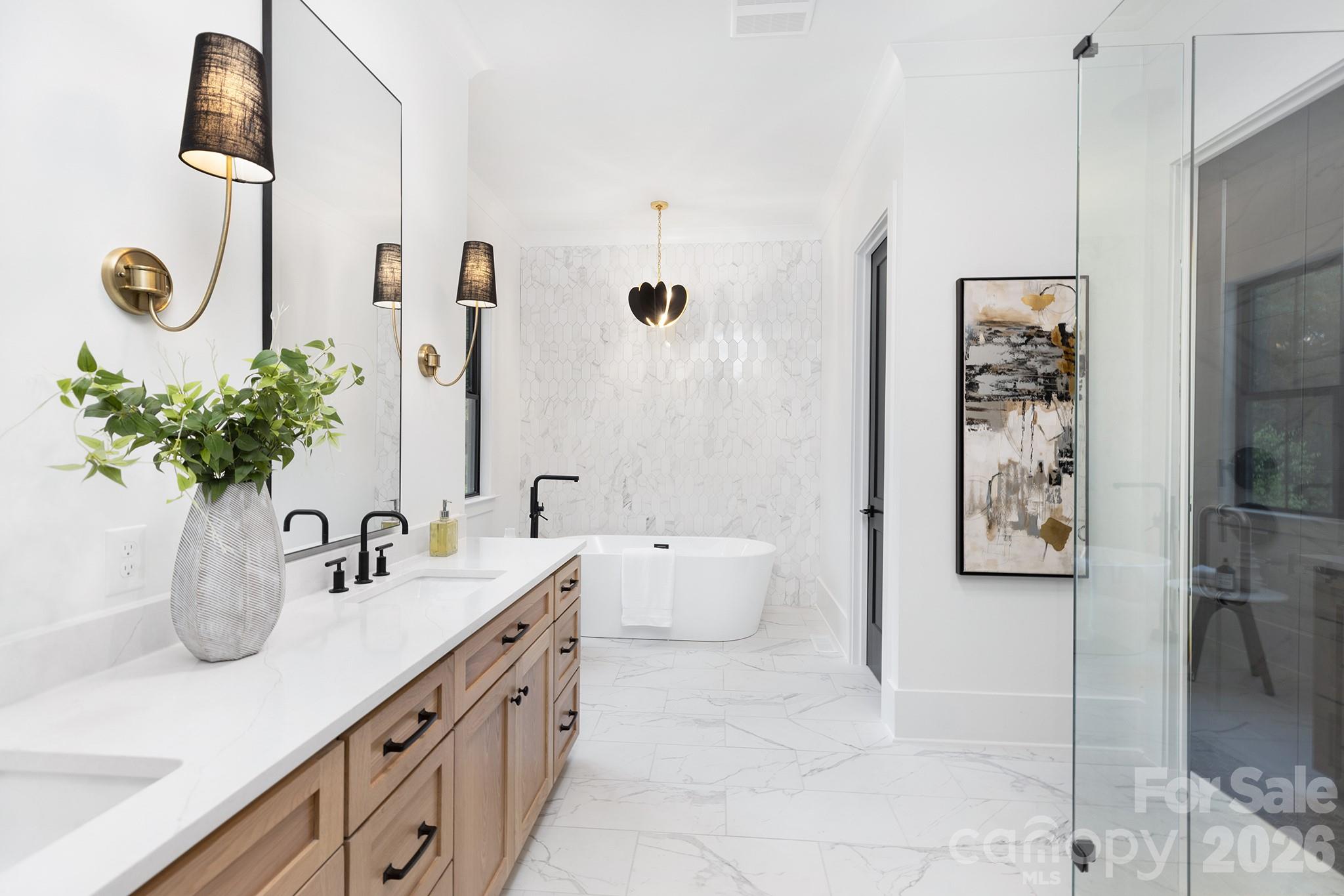 18304 Rosapenny Road Charlotte, NC 28278 - Photo 25 of 48 a bathroom with a double vanity sink and a mirror