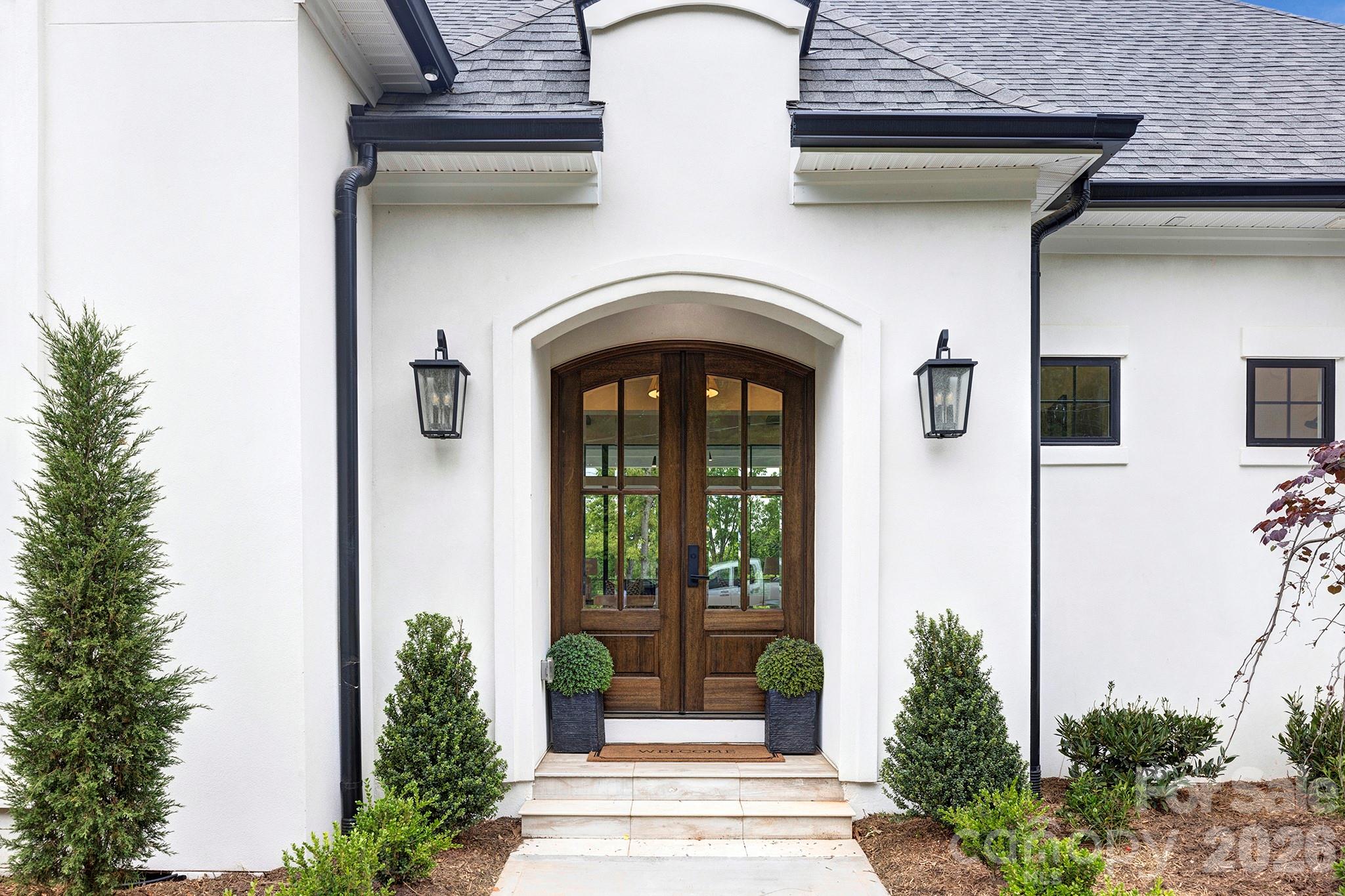 18304 Rosapenny Road Charlotte, NC 28278 - Photo 9 of 48 a front view of a house with a garden