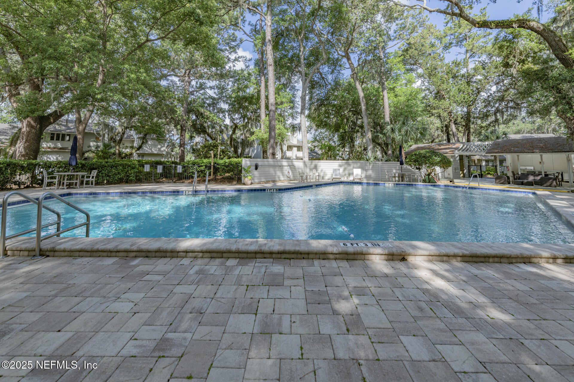 3426 Sea Marsh Road Fernandina Beach, FL 32034 - Photo 8 of 39 a view of a swimming pool with a patio