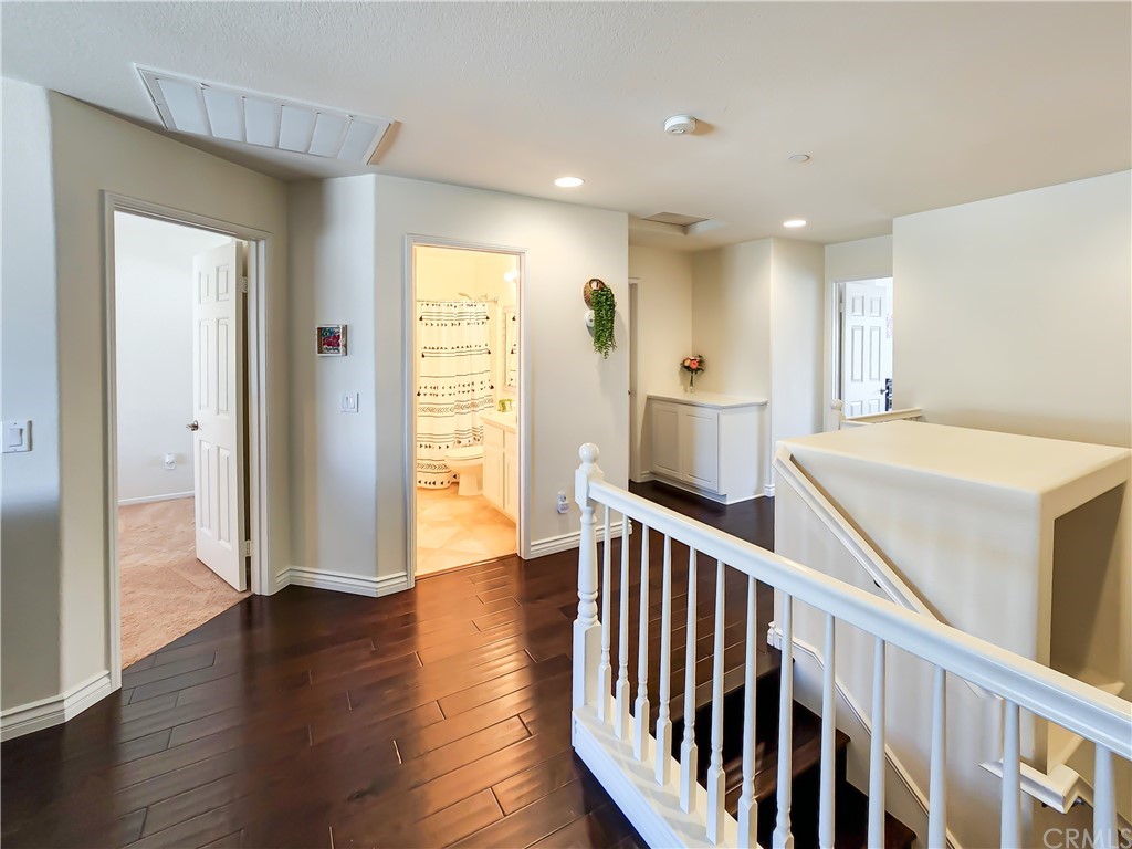 8024 Tulsa Place, Unit 107 Rancho Cucamonga, CA 91730 - Photo 13 of 35 a view of a kitchen with wooden floor and electronic appliances