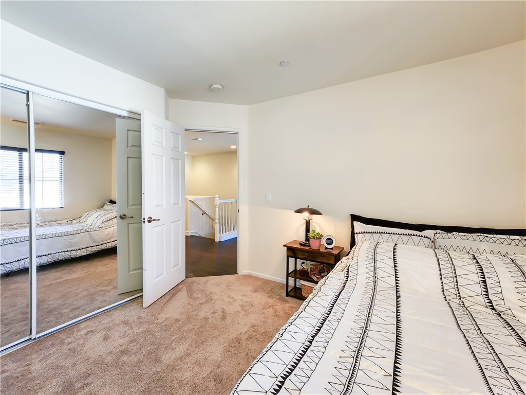 8024 Tulsa Place, Unit 107 Rancho Cucamonga, CA 91730 - Photo 18 of 35 a bedroom with a bed and a walk in closet