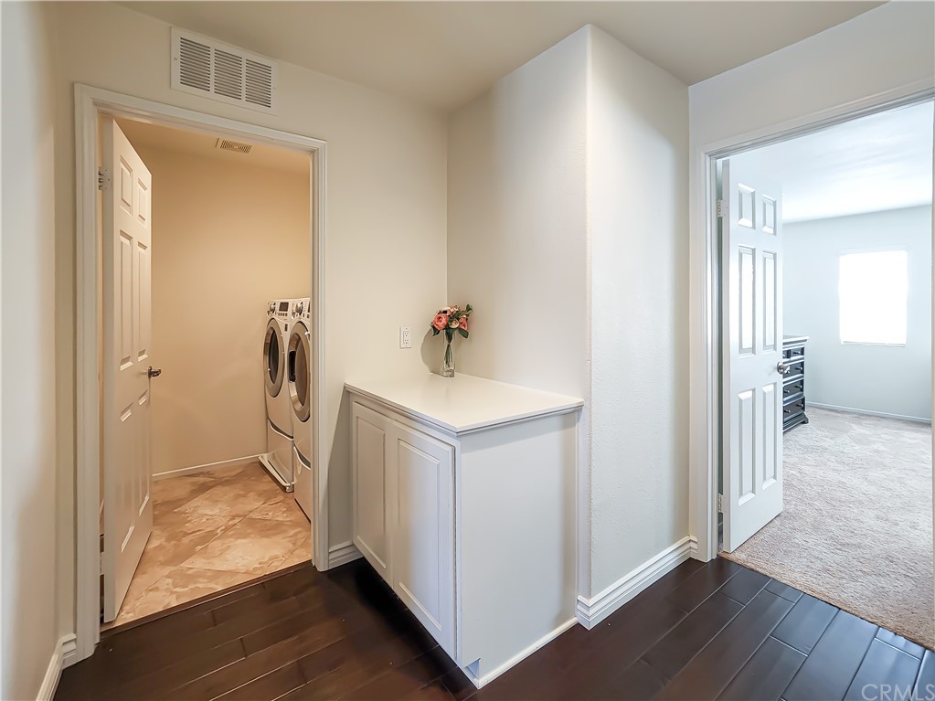 8024 Tulsa Place, Unit 107 Rancho Cucamonga, CA 91730 - Photo 20 of 35 a bathroom with a sink and mirror