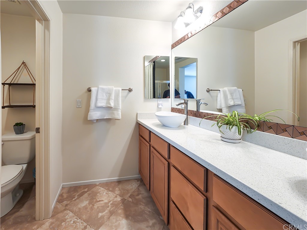 8024 Tulsa Place, Unit 107 Rancho Cucamonga, CA 91730 - Photo 24 of 35 a bathroom with a sink and a mirror