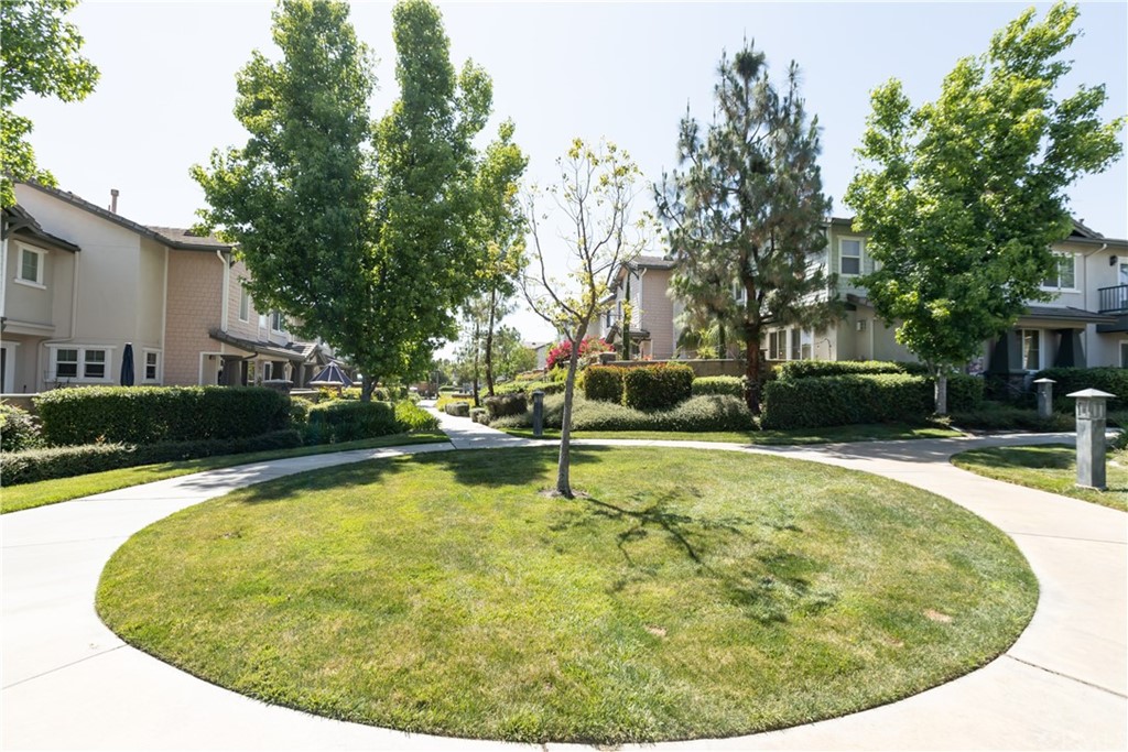 8024 Tulsa Place, Unit 107 Rancho Cucamonga, CA 91730 - Photo 32 of 35 a swimming pool with outdoor seating and yard